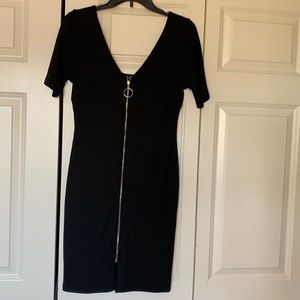 This is a short sleeve black dress where the zipper is on the front of the dress